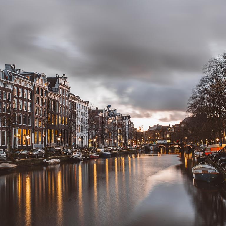Photo of Amsterdam canal at dusk