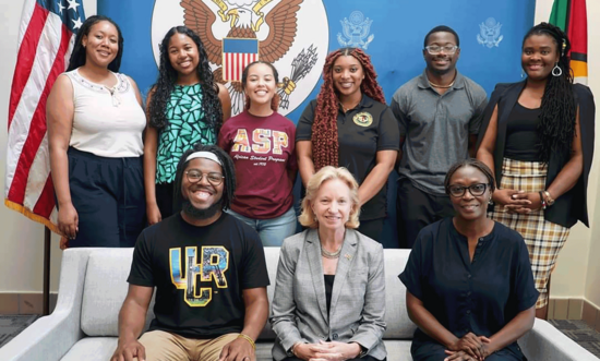 George (second from right, back row) with students and staff from the UCR African Student Programs and the U.S. ambassador to Guyana Sarah-Ann Lynch (center).
